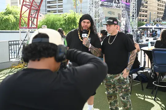 PMN+ camera crew filming an interview at a festival