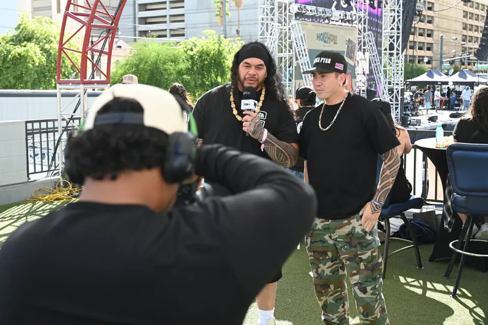 PMN+ camera crew filming an interview at a festival