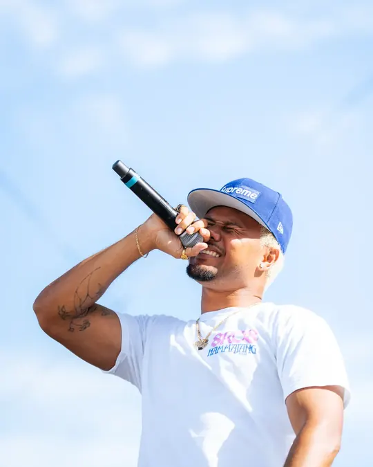 Artist in a blue cap performing outdoors
