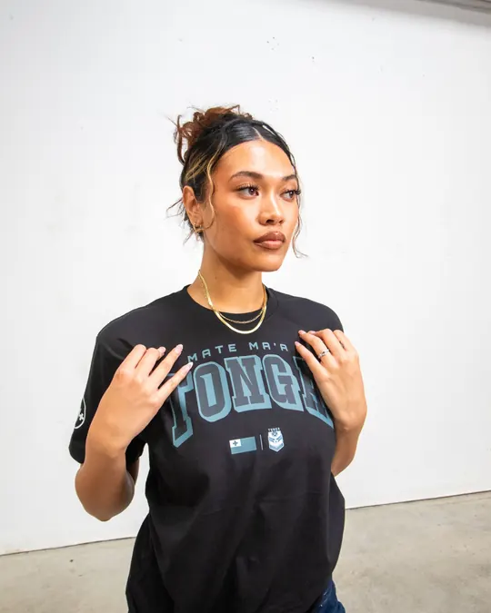 Model in a Mate Maʻa Tonga tee, hands on her collar