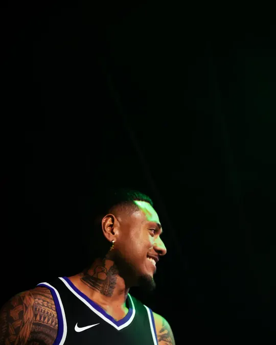 Singer in a Kings jersey on a dark stage